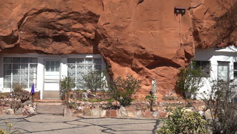 homes carved out of sandstone cliff, hole n'' the rock tourist attraction near moab, utah usa