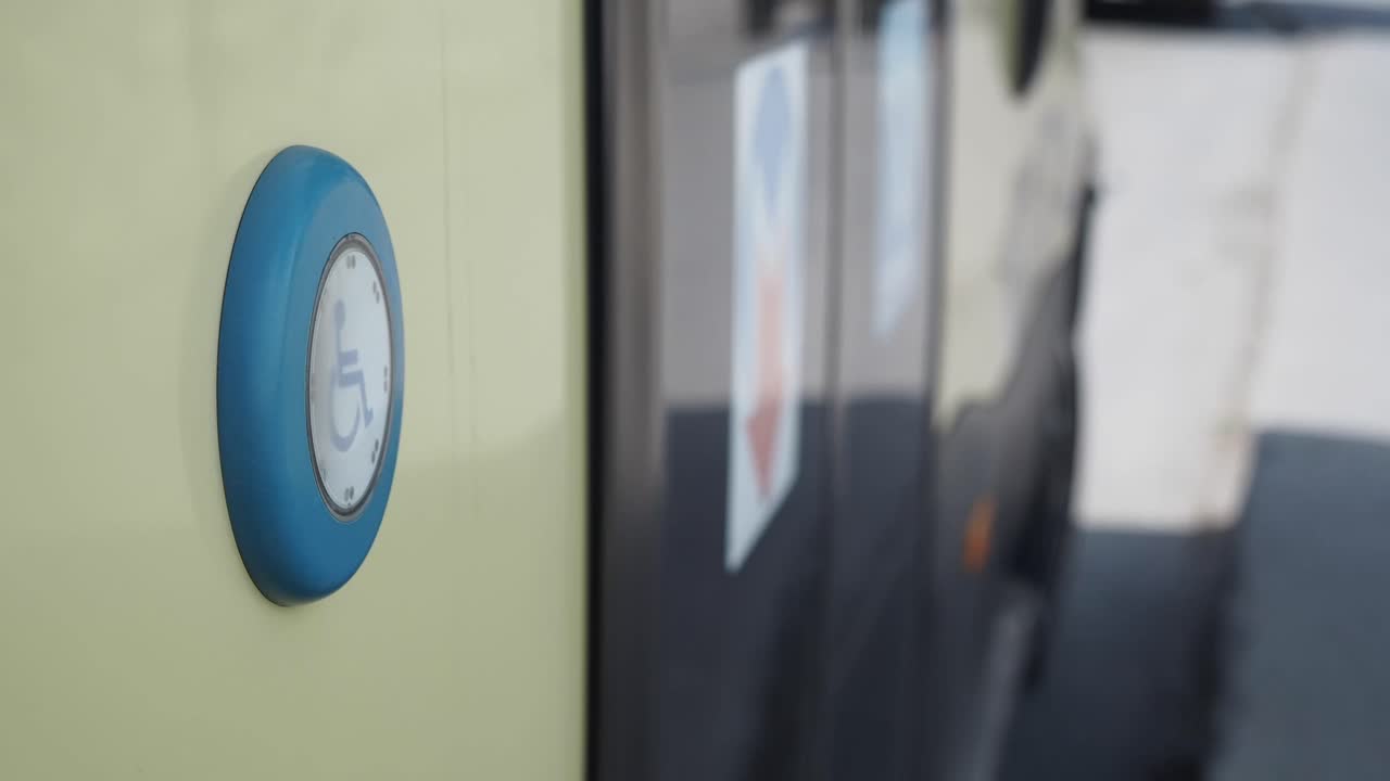 Accessibility button on a bus door