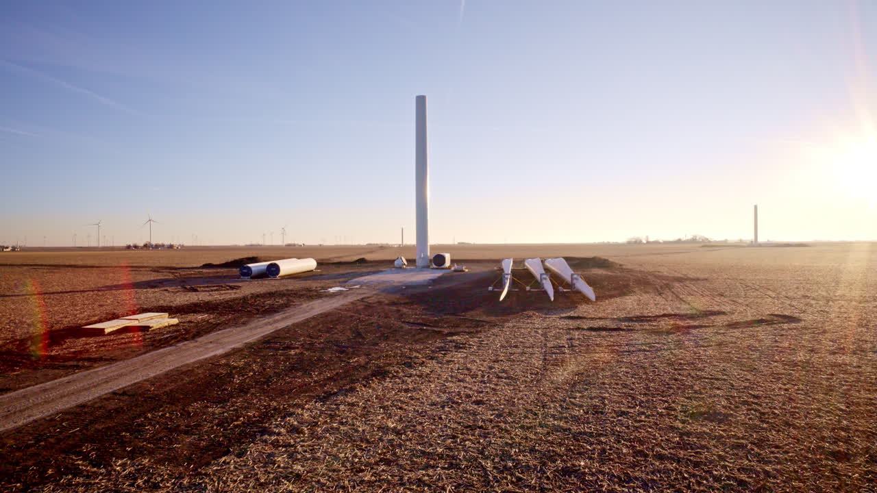 Aerial view of modern wind turbines being built in Illinois fields