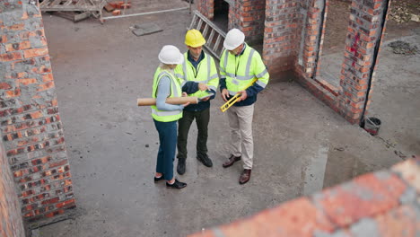 construction engineers discussing plans on site