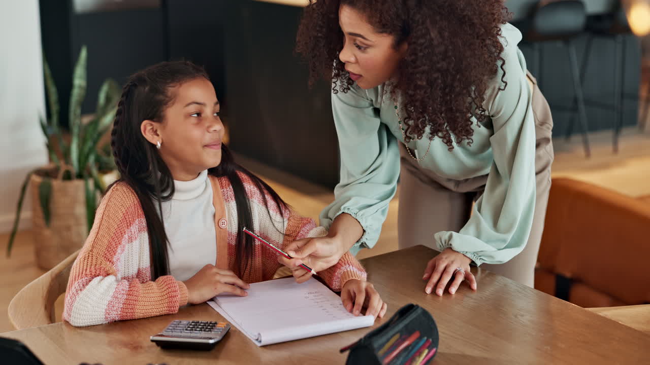 A mother helping her child with homework