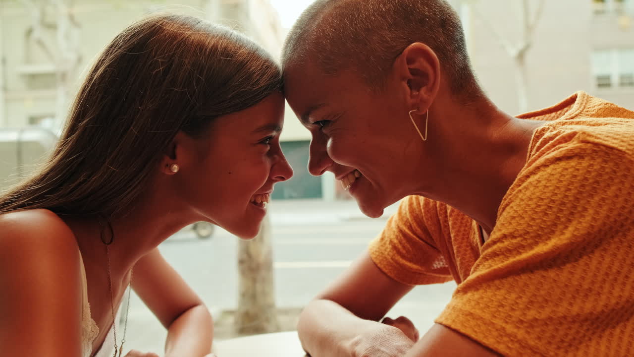 Happy Shaved Head Woman Smiling in Cafe