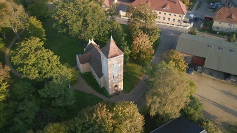 village church bell tower shines at sunset