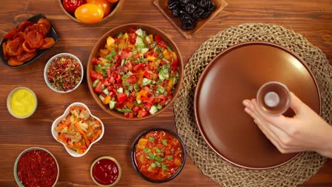 moroccan cuisine top view. tajine, traditional dish made of lamb and eggplant, vegetable salad. middle eastern culture. couscous with mutton close-up, delicious rice. homemade food.