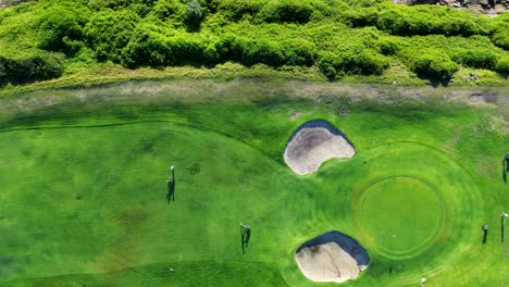 Bird's-eye-landscape-view-of-people-on-golf-course-grass-lawn-greens-fairway-with-sand-bunker-garden-sport-Randwick-Malabar-Sydney-drone-aerial