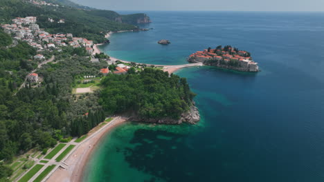 drone footage flying over sveti stefan beach in montenegro