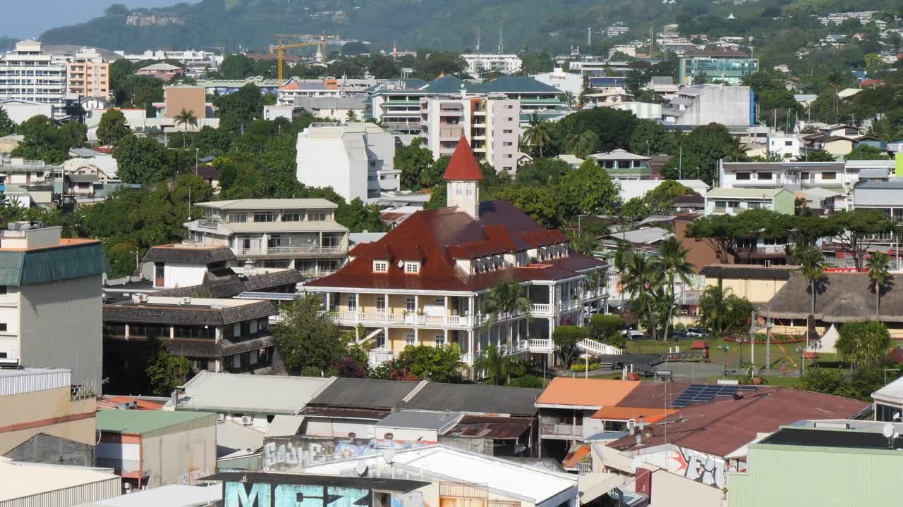 Papeete Town Hall, is a faithful replica of the Mansion of Queen Pomare IV and is painted in buttercup yellow, Neoclassical architectural style.