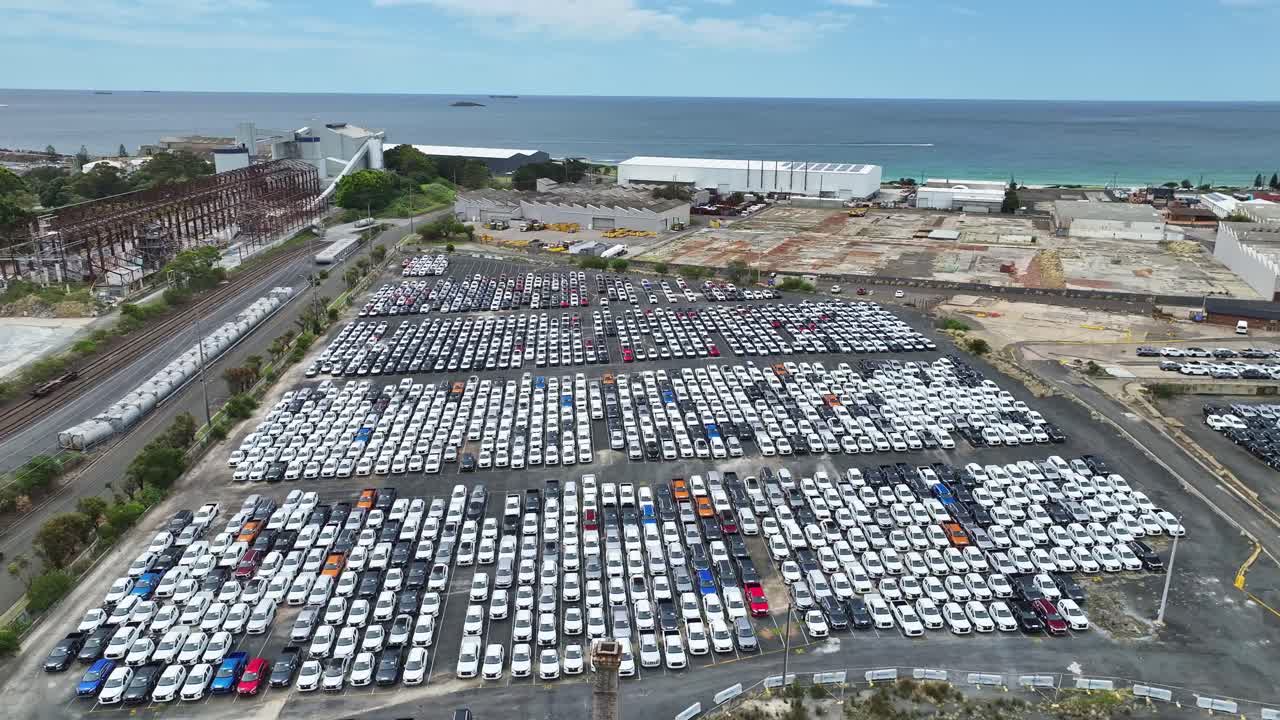 Aerial view of cars stored at Port Kembla after arrival by ship for Australian buyers