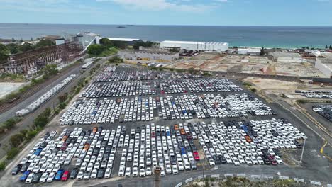 aerial view of cars stored at port kembla after arrival by ship for australian buyers