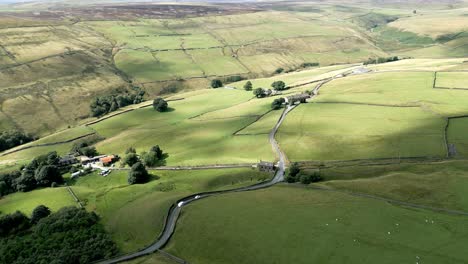 summer farmland with patchwork fields panorama with groves and trees, shot using a drone aerial footage