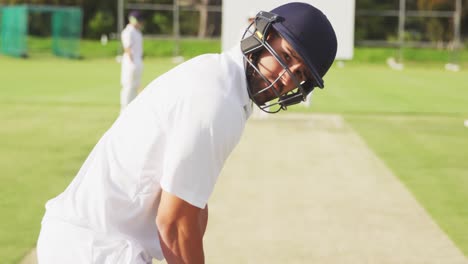 cricket player standing and looking at the camera