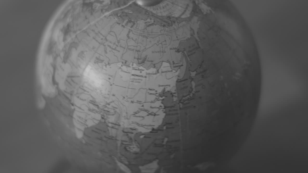 Old World Globe Rotating in Black and White Focused on Europe
