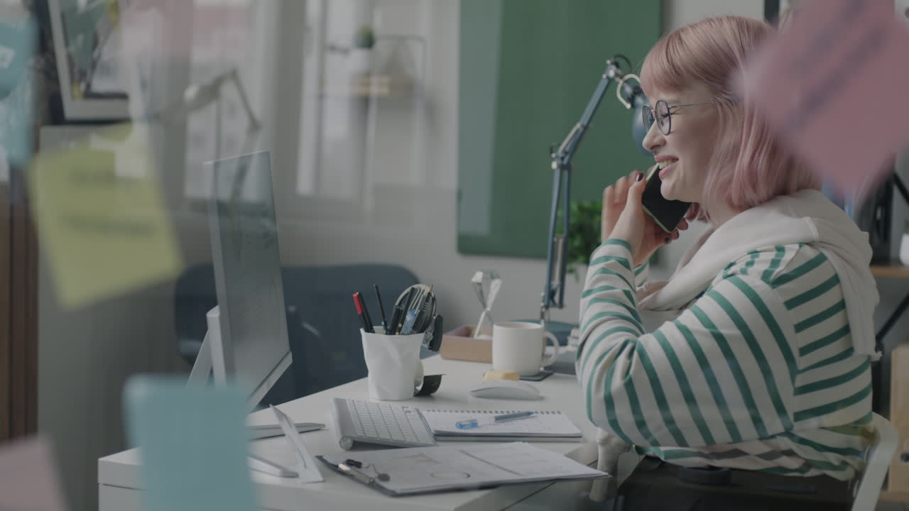 Woman in Office Discussing Project