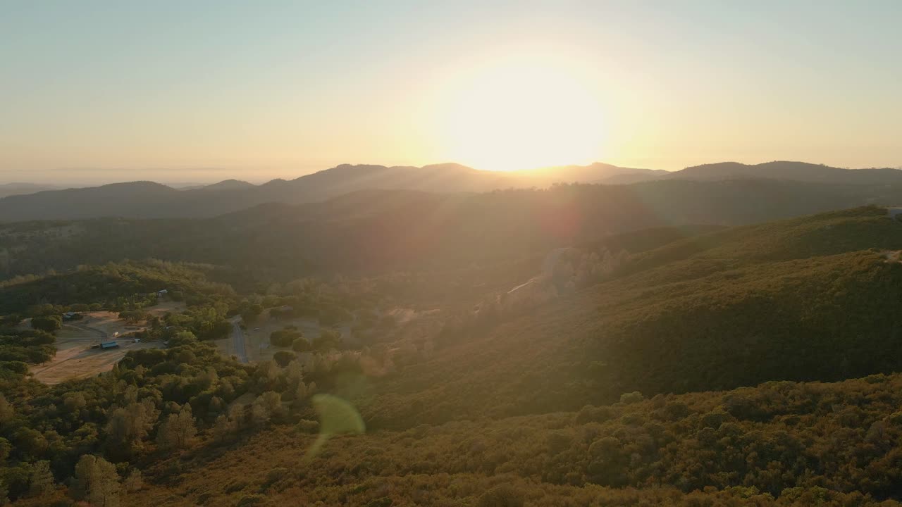 California sunset as seen from above. The sun casts its warm glow over the majestic mountain ranges.Shot in 4K with Sony A7S III and DJI RS2.