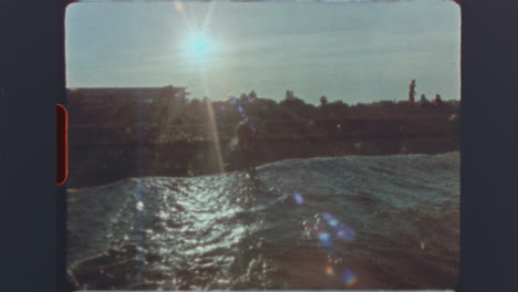vintage super 8 film footage of people outdoors with sun flares