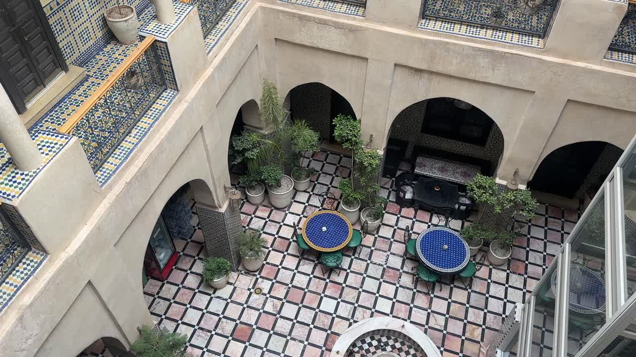 Interior of Moroccan riad hotel courtyard traditional architecture Morocco North Africa