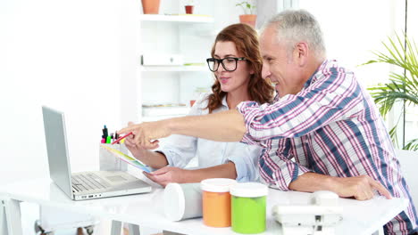 Casual-business-workers-using-laptop-computer