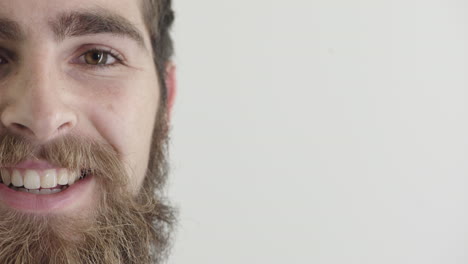 close-up-young-man-hipster-beard-smiling-happy-wearing-nose-ring-on-white-background-half-face