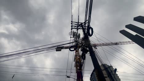 urban skyline with overcast sky and construction crane