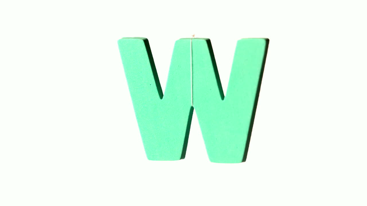 W magnet rotating on white background