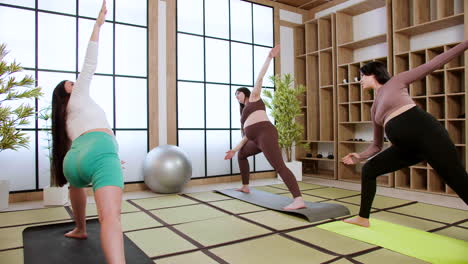 women doing yoga indoors