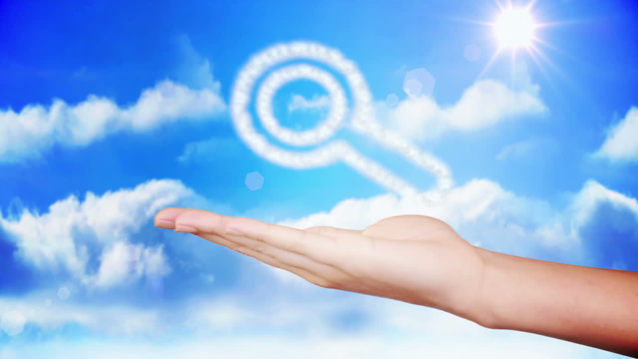 손으로 확대 유리 구름 디자인을 제시합니다.