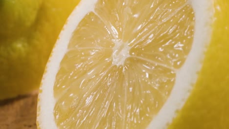 macro shot half lemon, water flowing down fresh textured surface in slow motion, juicy fruit