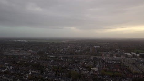 Ibis-Cambridge-Central-Station,-drone,-look-from-sky,-foggy