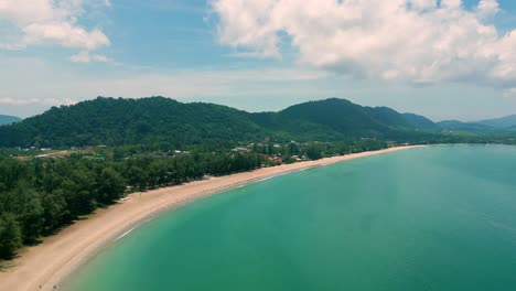 4K-Cinematic-nature-drone-footage-of-a-panoramic-aerial-view-of-the-beautiful-beaches-and-mountains-on-the-island-of-Koh-Lanta-in-Krabi,-South-Thailand,on-a-sunny-day