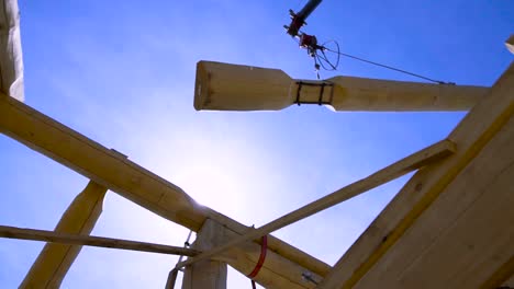 log cabin construction with crane