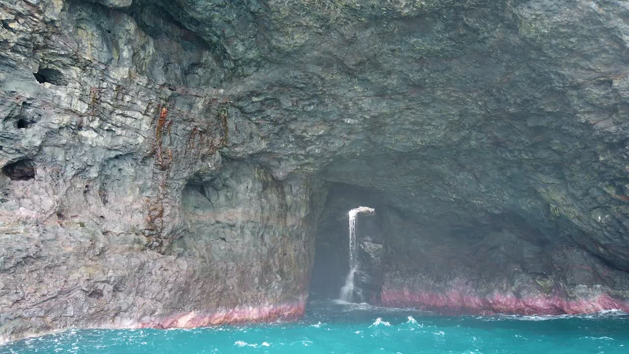 Stunning Ocean Cave with Waterfall