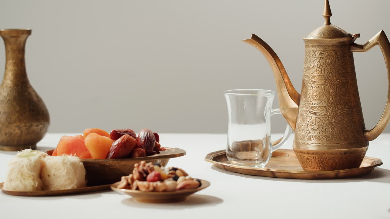 Traditional Arabic Tea Ceremony with Sweets and Dates