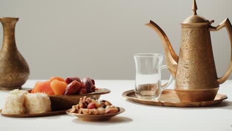traditional arabic tea ceremony with sweets and dates