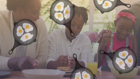 animación de sartenes cayendo sobre una familia afroamericana cocinando juntos en la cocina