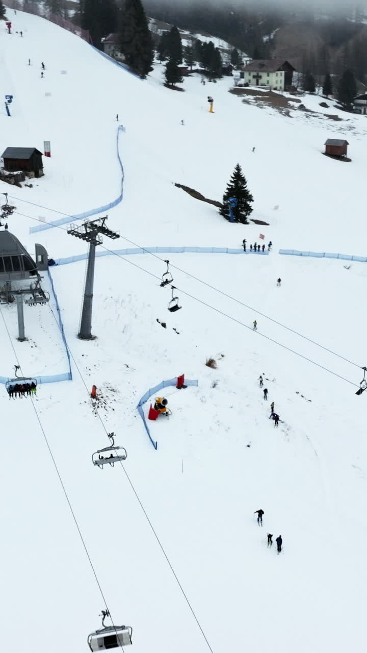 Aerial drone view of the Arabba mountain village in the Dolomites, Italy. Vertical
