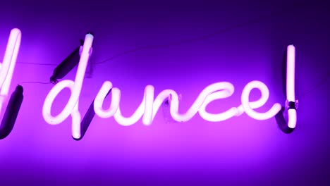 dance word neon sign in 4k