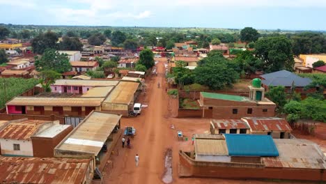 drone flying low over an african village market