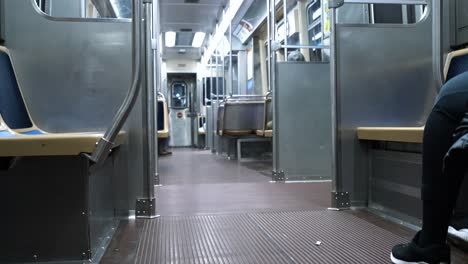 static shot of people riding subway train in downtown chicago