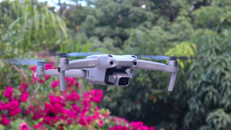 close-up of drone quadcopter with digital camera flying in air