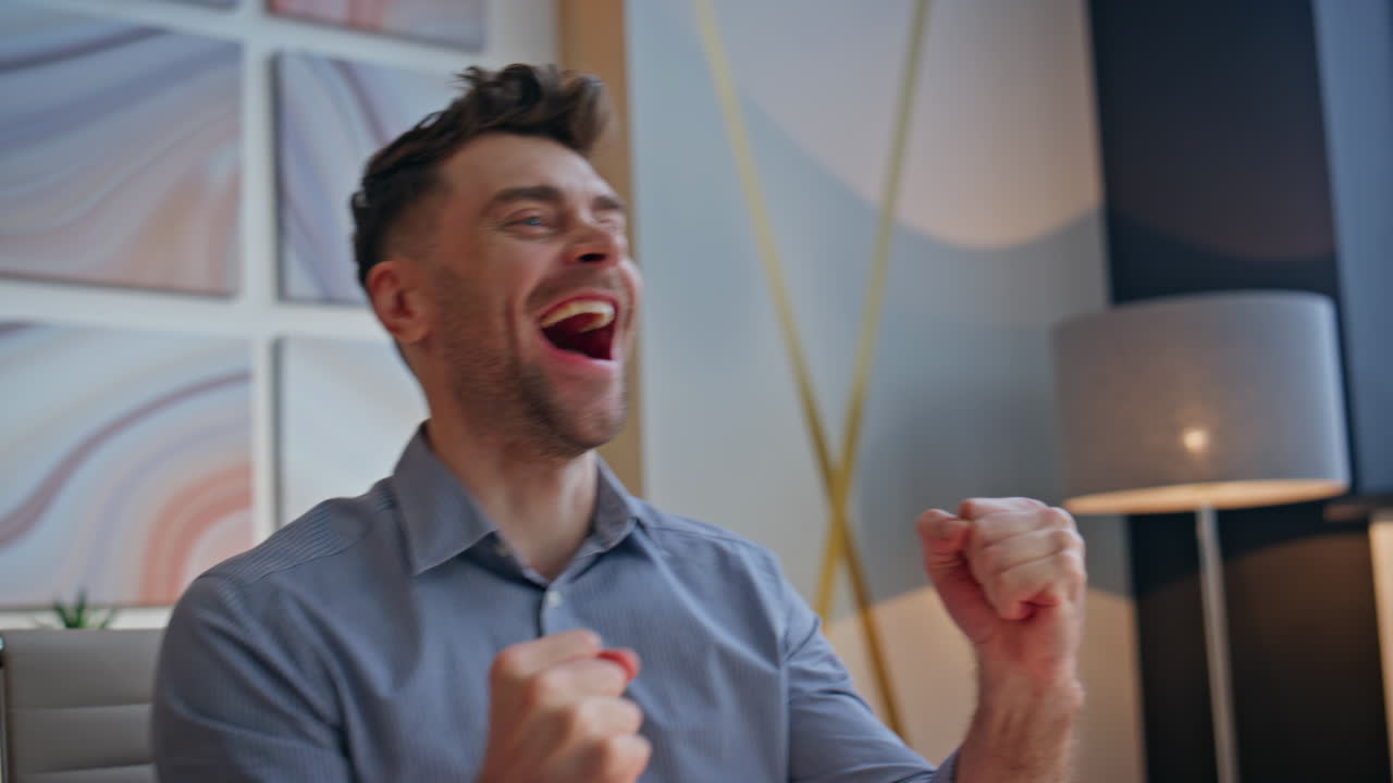 Excited winner rejoicing workplace reading great news at laptop office closeup