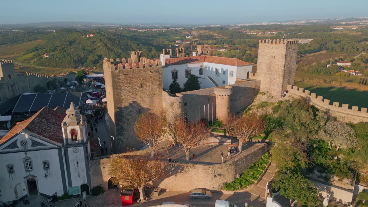 Drone grand medieval castle with towers standing proudly. Historic architecture