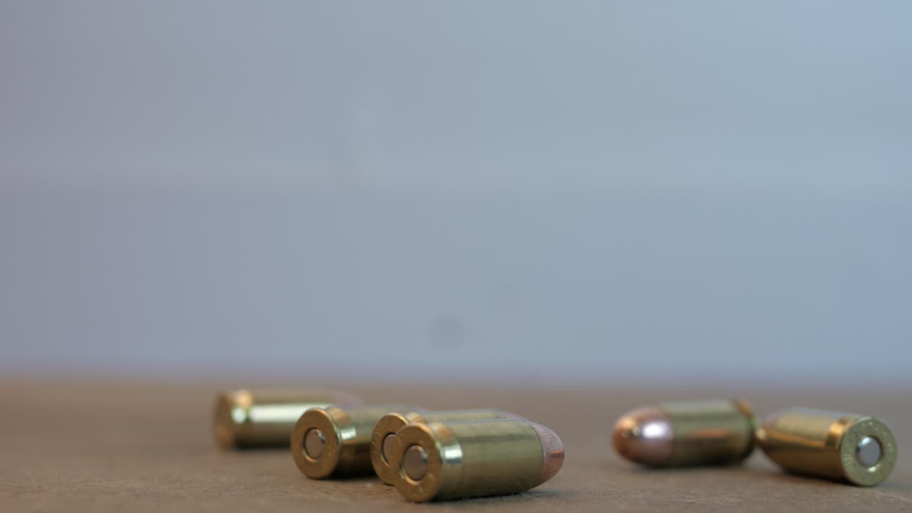 Bullets falling onto a table 45 caliber