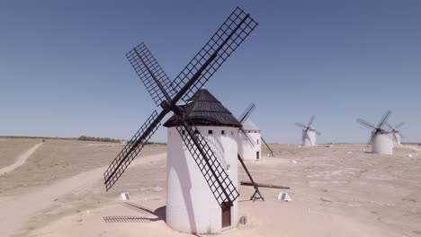 spanish windmill, aerial view in orbit of the colorful windmill of la mancha. campo de criptana. spain