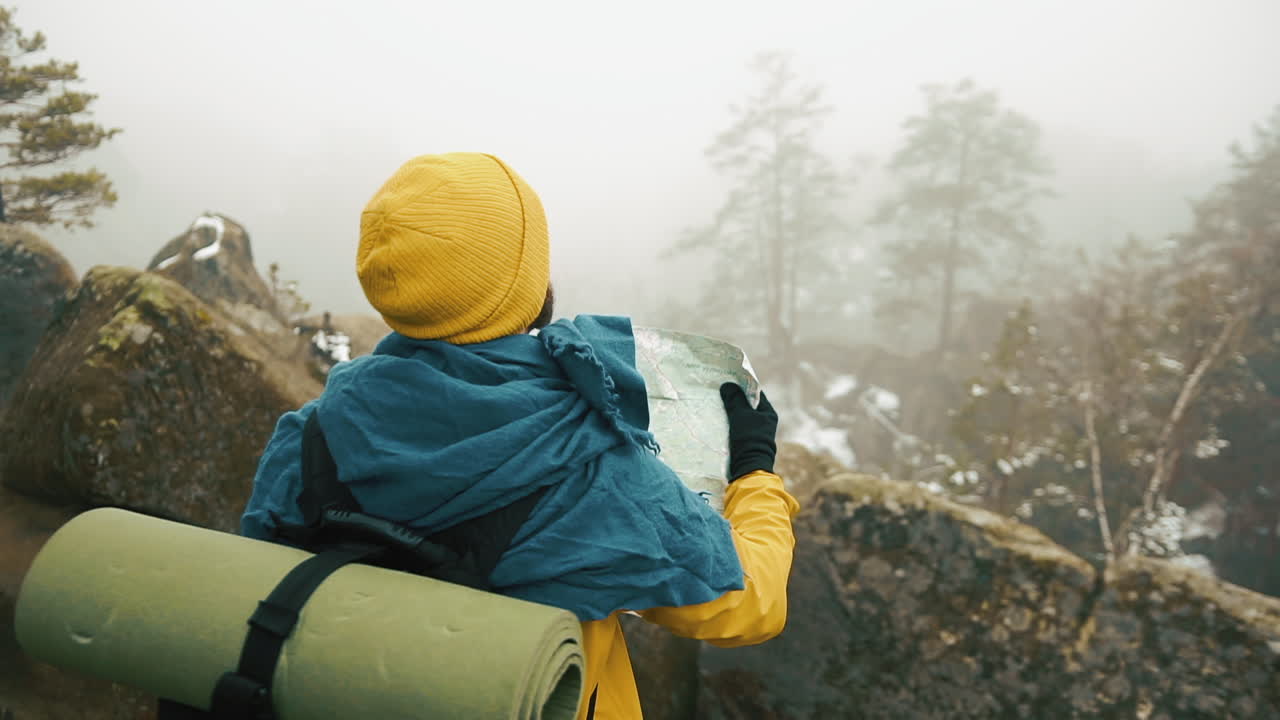 Man hiking in nature with map