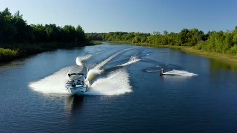 wakeboarding behind a boat on a lake in michigan