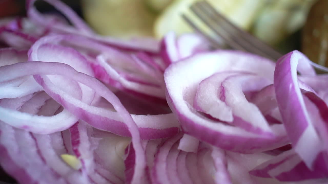 Closeup Detail Shot of Sliced Purple Onions and Pickles, Slow Motion