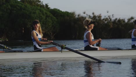 Female-rowing-team-training-on-a-river