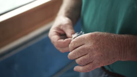 SLOWMO---Close-up-of-man-prepping-fly-fishing-line