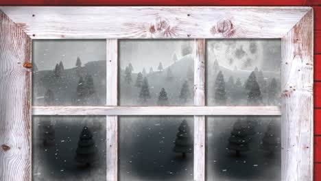 Wooden window frame against snow falling over multiple trees on winter landscape