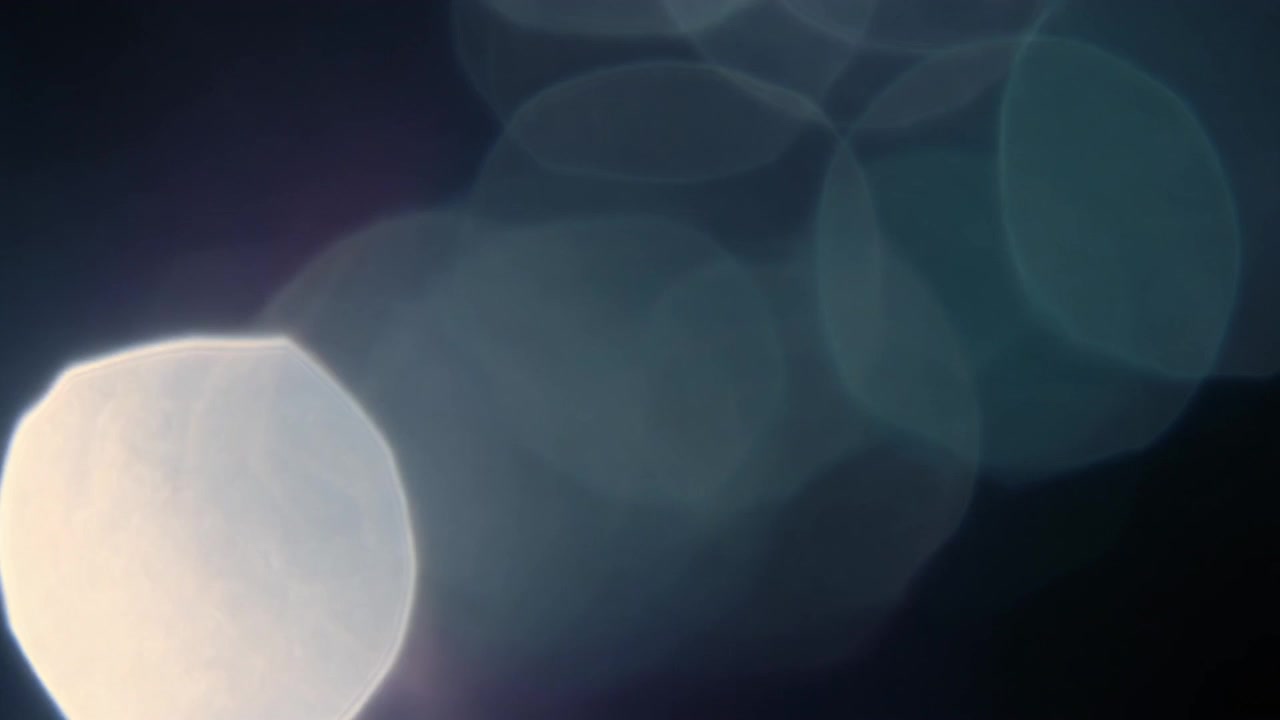 Abstract Light Bokeh Effect on Dark Background